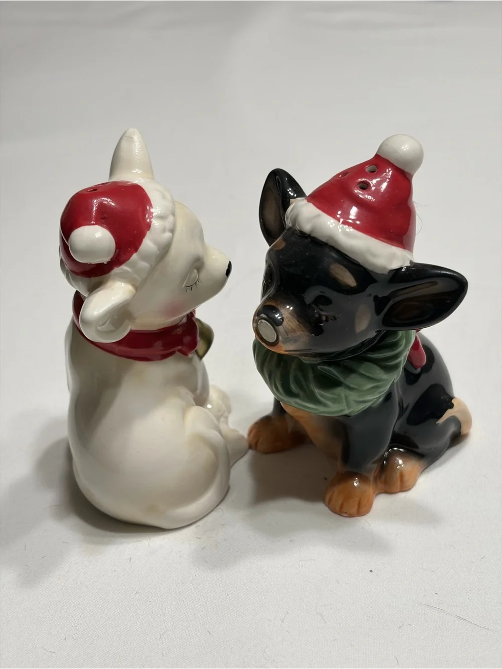 Chi Chi  Ceramic Salt and Pepper Shakers. Magnetic kissing.